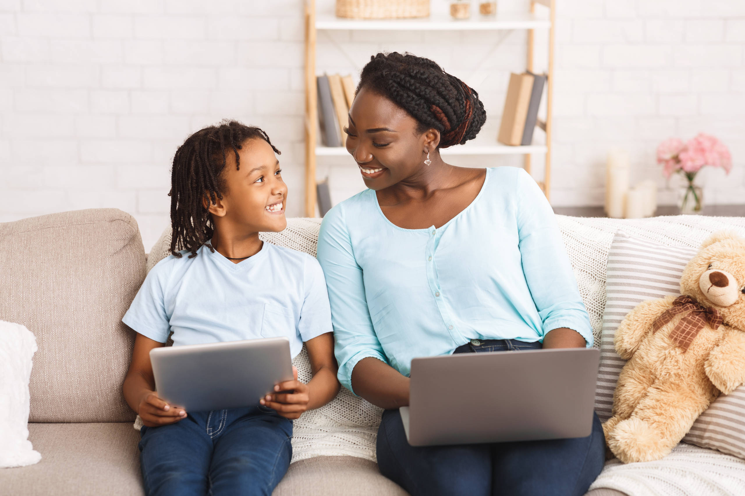 Black mom and daughter planning their dream trip