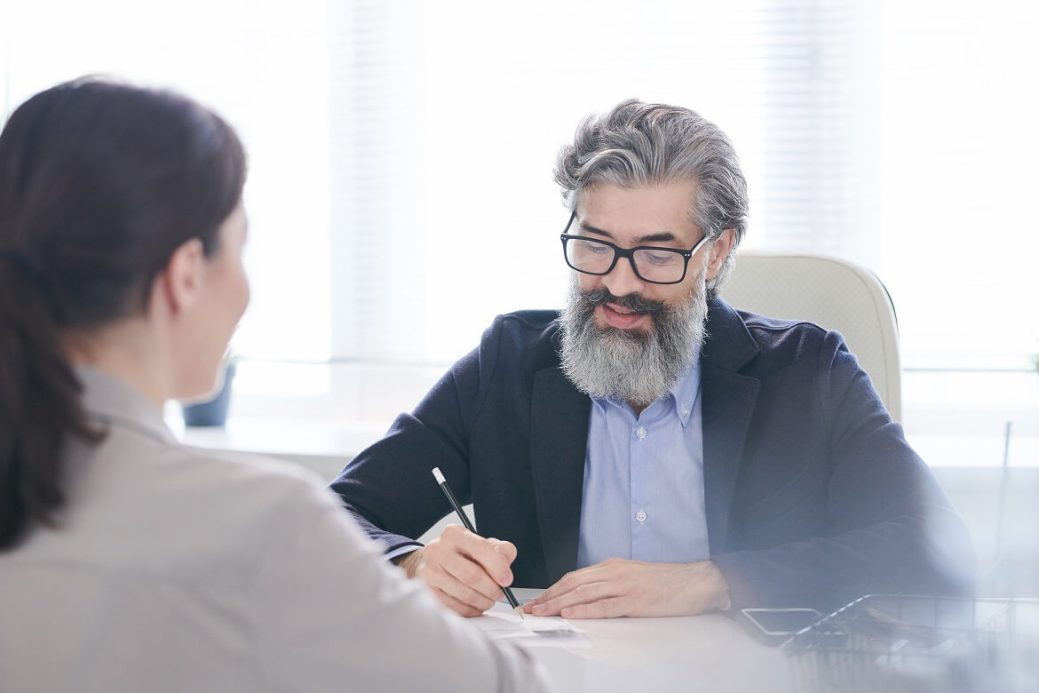 senior male employer in eyeglasses and formalwear