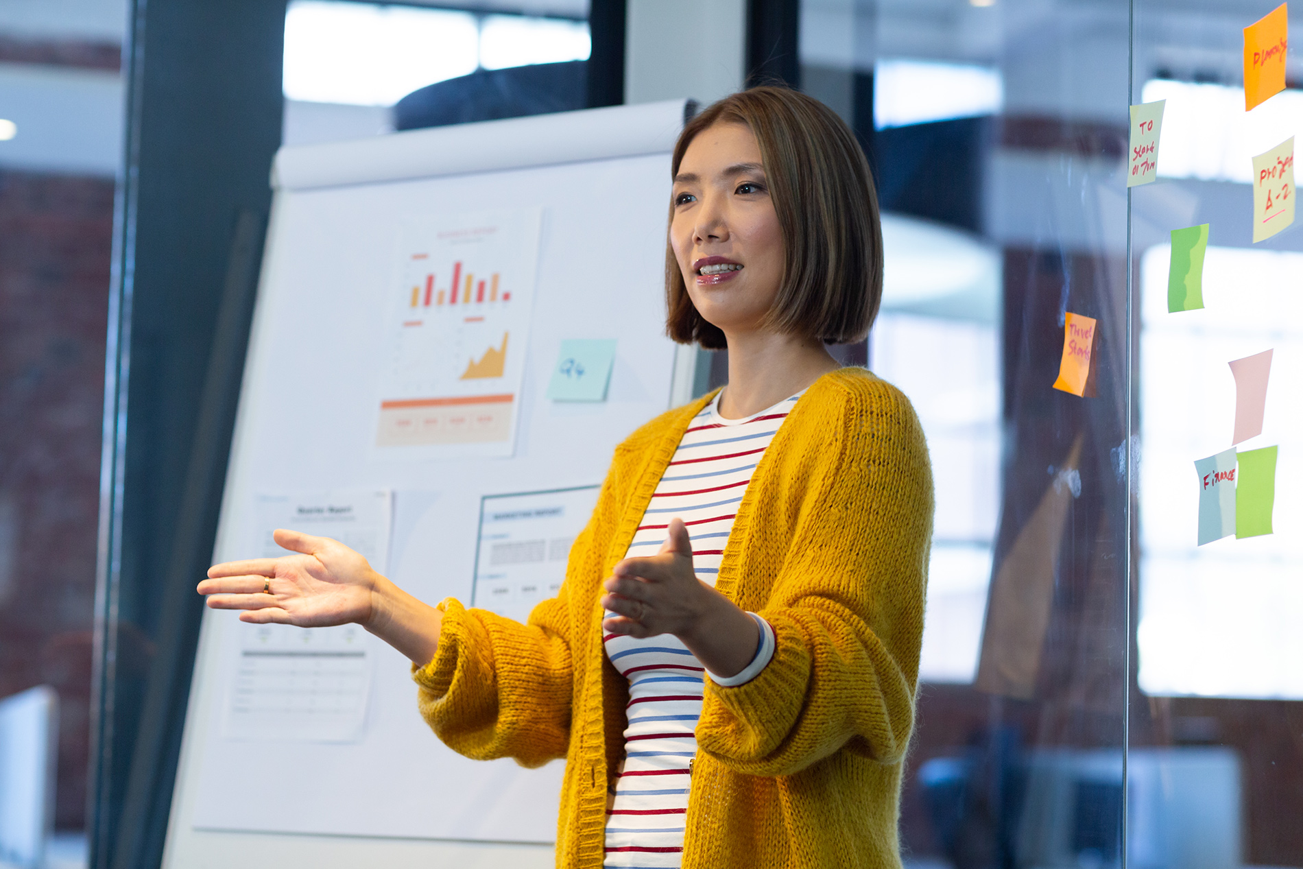 businesswoman standing in front of whiteboard