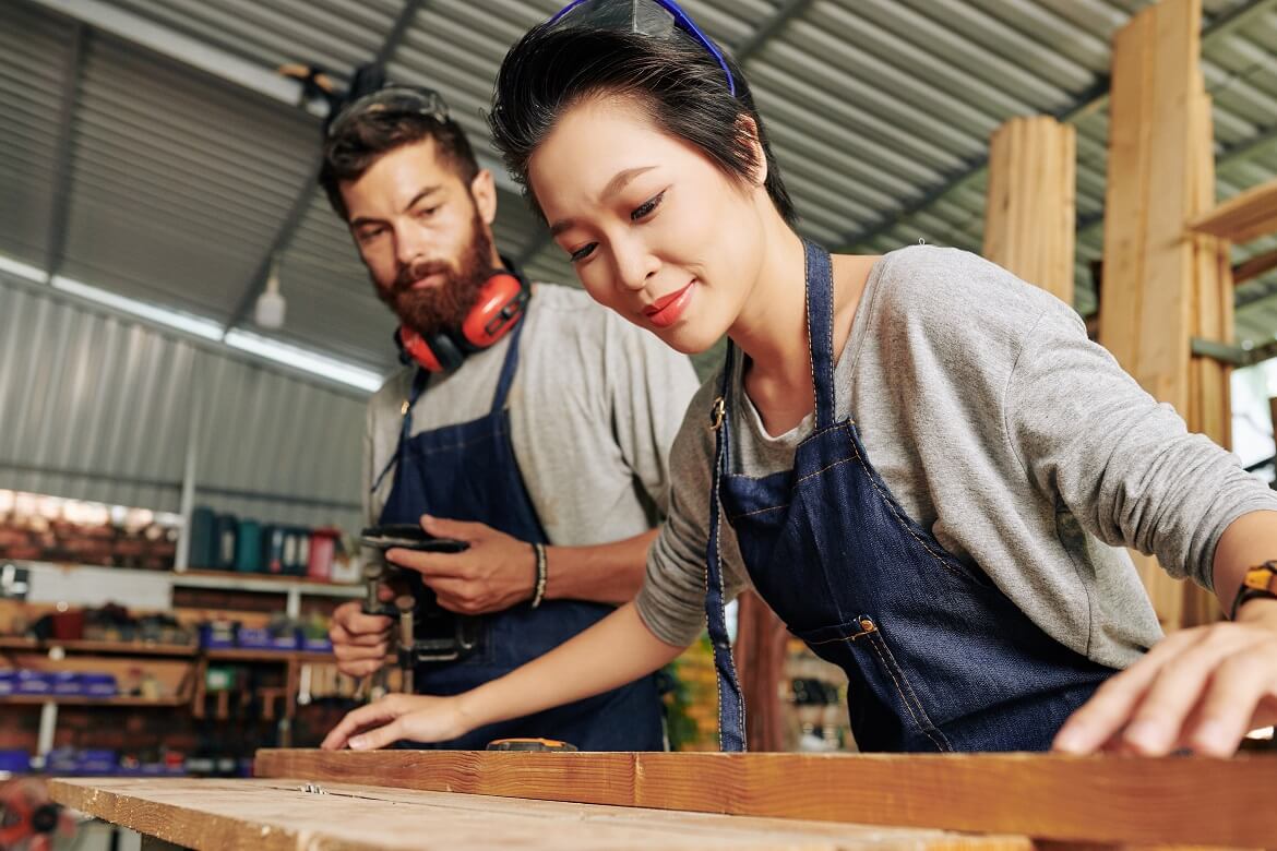 female carpenter working with wood