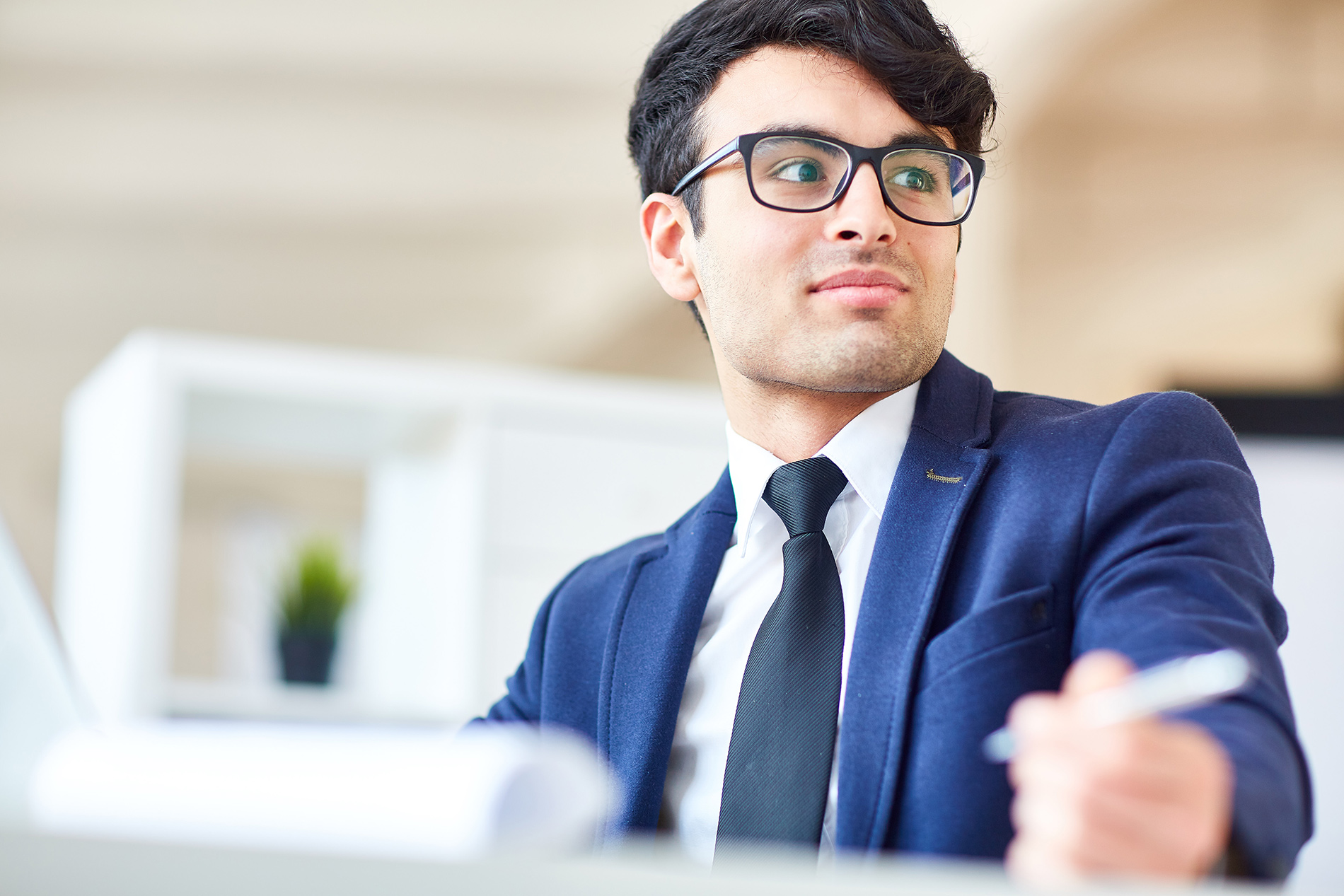 attentive male employee with glasses