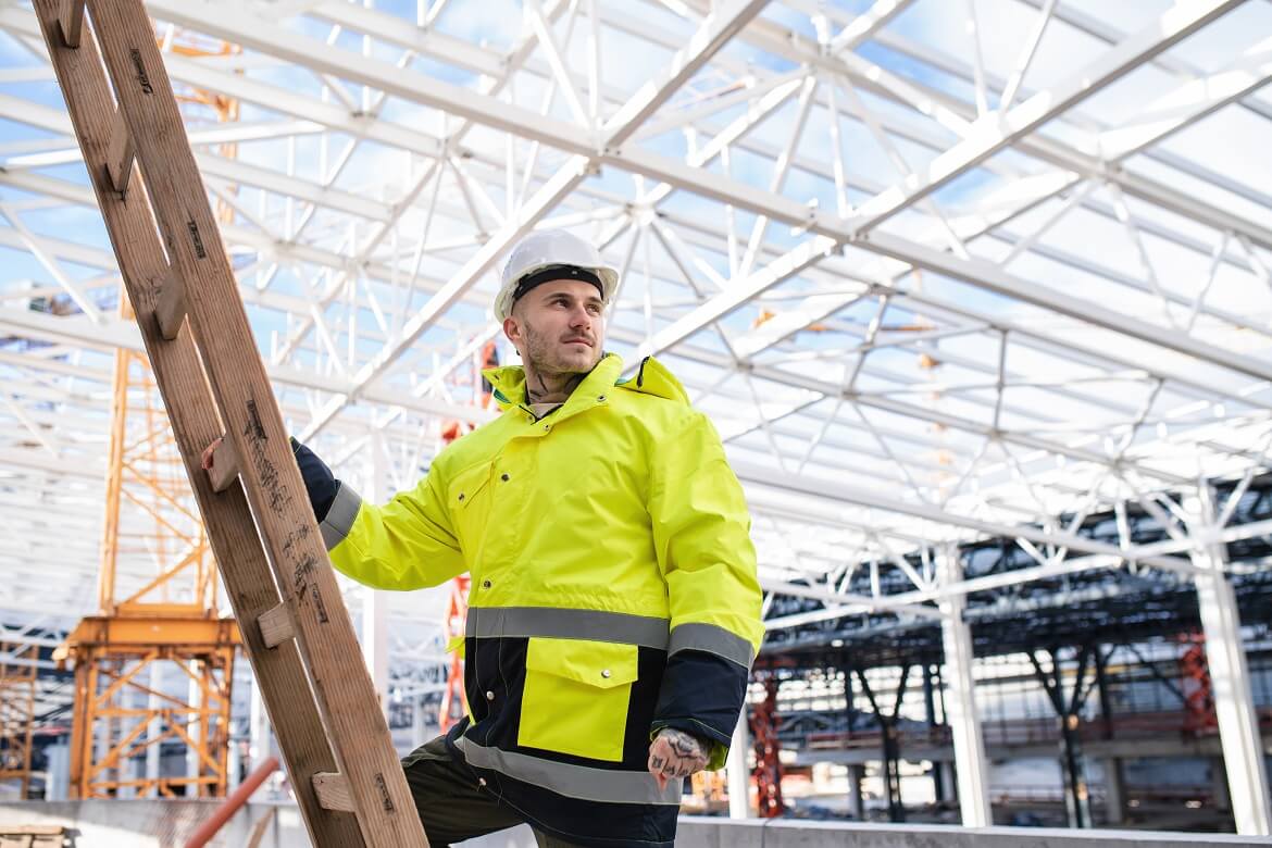 a male worker outdoors on construction site working