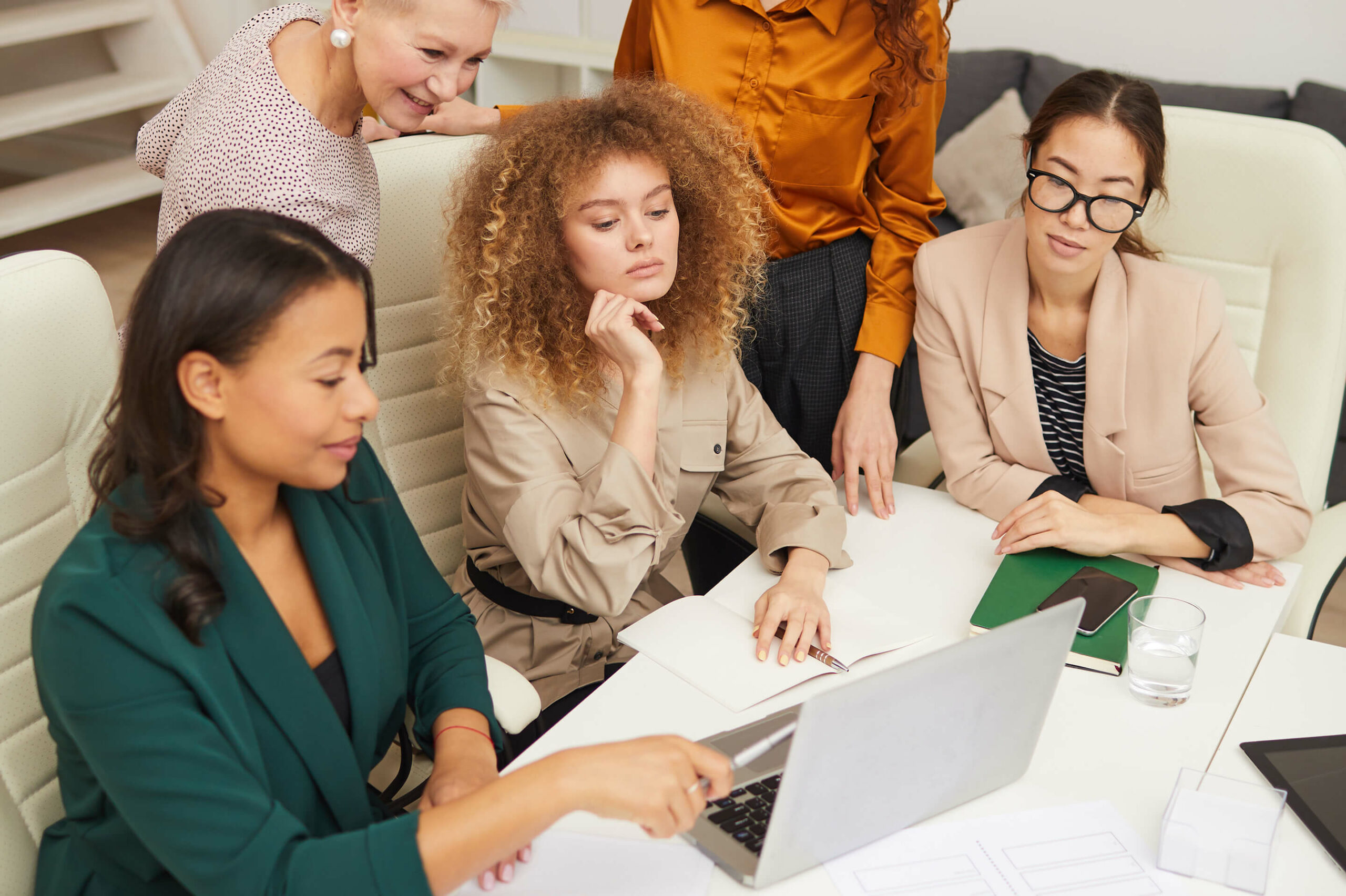 Ethnically Diverse Businesswomen Working Together on a Laptop