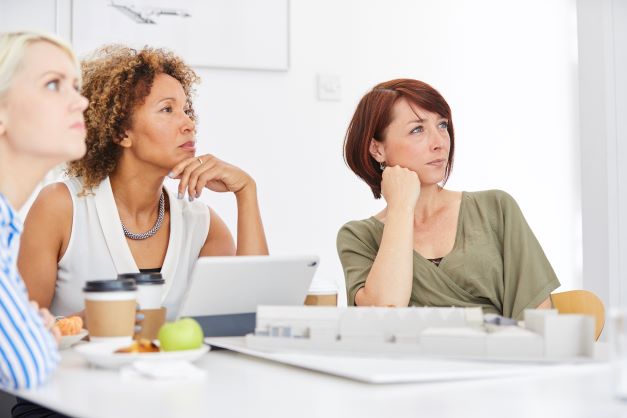 Group of diverse women listening