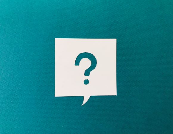 Question mark in speech bubble on teal background