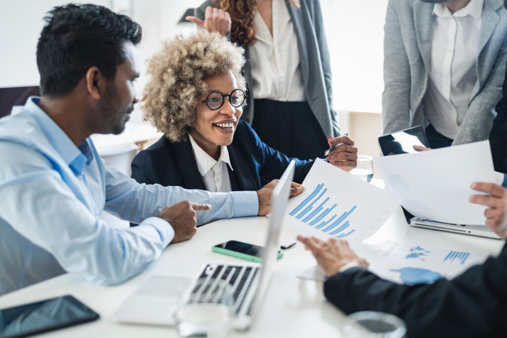 Smiling business people working together in modern office